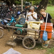 Lisa learning how pressed sugarcane juice is made