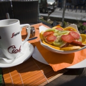 Lisa\'s perfect breakfast: tea and a bowl of fruit with yoghurt