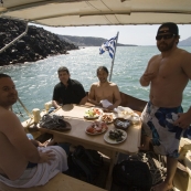 Squino, Greg, Tariq and ET with the volcanic rocks of Nea Kameni in the background