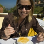 Lisa enjoying yoghurt and honey for breakfast in Pelekas