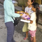 Lisa bargaining with some girls on the streets of Luang Prabang