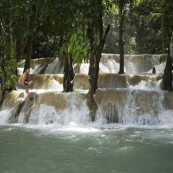 Sam jumping off Tad Sae Waterfall