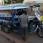 One of the more colorful tuk-tuks on the streets of Luang Prabang