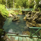 The spring-fed swimming hole outside Thamchang Cave