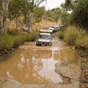 Lisa mastering one of the deeper water crossings on the road into Purnululu