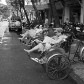 Cyclo drivers waiting out the mid-afternoon rain