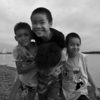 Some of the local boys horsing around next to the Mekong