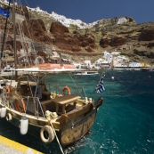 Ammoudi, Oia on the cliffs above and our boat for the afternoon of the bucks show