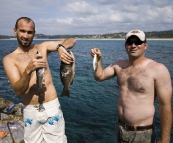 Sam and Jarrid with fresh fish from the reef at Bannisters Point