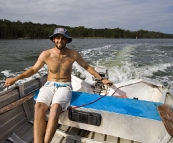 Sam piloting the dinghy around Lake Conjola