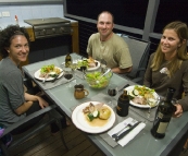 Jacque, Jarrid and Lisa with a lamb roast at Lake Conjola