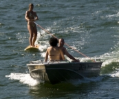 Lisa riding the surfboard in Lake Conjola