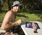 Sam cleaning a Mulloway in Booti Booti National Park