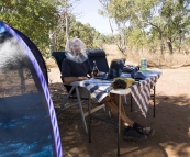 Sam having an afternoon beer and working on the blog in his fly net