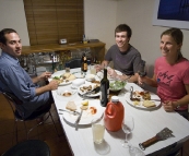 Cal, Sam and Lisa sitting down for dinner