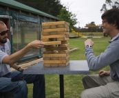 Sam and Sergey playing the huge Jenga at Bootleg Brewing Company