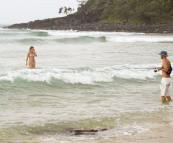 Sam fishing with Lisa in the surf at Tea Tree