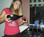 Lisa with a bottle of sparkling red