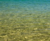Crystal clear water on the beach at Sandy Cape