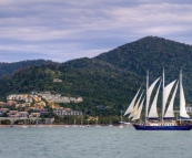 Sailing ship in for the night with Airlie Beach and Conway National Park in the background
