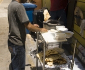 Making naan bread on the streets of Little India