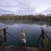 Sam taking a morning dip at Dalhousie Springs