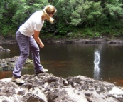 Lisa skimming rocks on the Frankland River