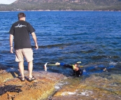 Greg helping Sam with a Yelloweye Mullet in Coles Bay