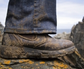 Muddy boots after a trip to the Seal Rocks cave