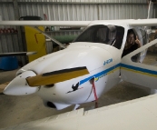 Lisa in the cockpit of Grant\'s ultralight Jabiru plane