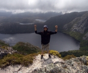 Sam on top of Crater Peak with Crater Lake in the background