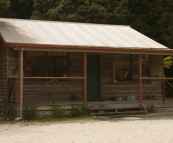 One of the cottages run by the Tarkine Hotel in Corinna