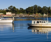 Fishing boats in the morning light in Strahan