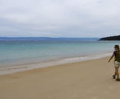 Lisa walking along Hazards Beach on our hike back from Wineglass Bay