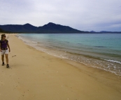 Lisa walking along Hazards Beach on our hike back from Wineglass Bay