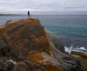 Greg standing on the rocks at Bay of Fires