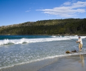 Sam fishing for Salmon Trout at Fortescue Bay