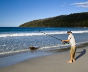 Sam fishing for Salmon Trout at Fortescue Bay