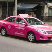A typical pink taxi in Bangkok
