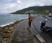 Lisa taking a rest next to our moped on our ride along the northwest coast of Phuket