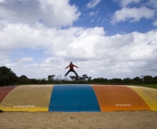 Lisa enjoying the air-filled trampoline at Ocean Beach