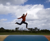 Lisa enjoying the air-filled trampoline at Ocean Beach