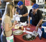 Lisa talking to one of the oyster merchants at the Boat Shed Markets