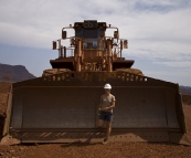 Lisa in front of a retired dozer's shovel