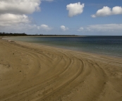 Boggy sand along Seven Mile Beach