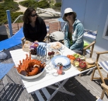 Lisa and Gina with a mountain of crayfish