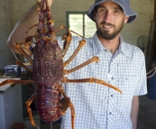 Sam and a monster crayfish at Al's cousin's farm