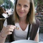 Lisa enjoying on of her favorite mezes: olives wrapped in anchovies