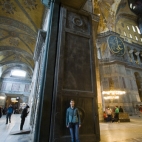 Lisa standing in front of the gigantic Imperial Door separating Aya Sofya's main dome from the inner narthex