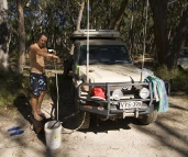 Chris enjoying a hot shower at Strachans campground